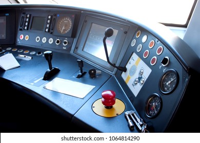 Red Button Of Emergency Brake And Keys From The Door Of The Train Lying On The Control Panel In The Cabin Of Train