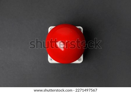 Red button of nuclear weapon on grey background, top view. War concept