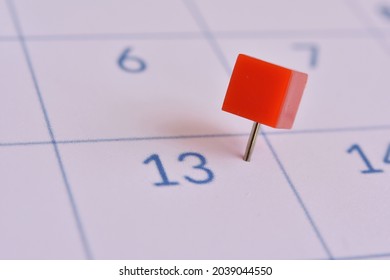 Red Button On Number 13 Of The Calendar. Reference Point