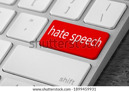 Red button with text Hate Speech on computer keyboard, closeup