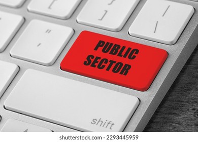 Red button with text Public Sector on computer keyboard, closeup
