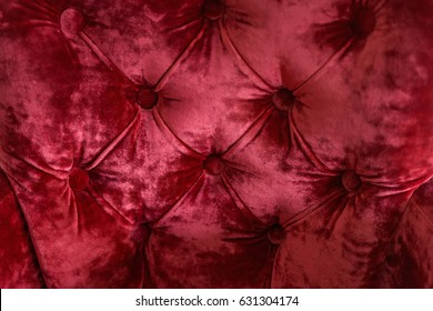 Red Buttoned Velvet Couch Surface