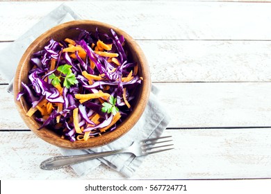 Red Cabbage Coleslaw Salad with Carrots and Greens - healthy diet, detox, vegan, vegetarian, vegetable spring salad, copy space for text - Powered by Shutterstock