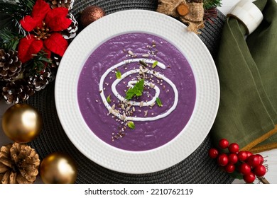 Red Cabbage Cream Decorated With Cream On A Christmas Table.