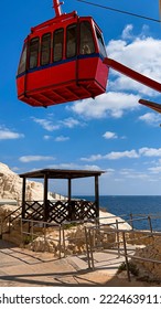 Red Cable Car Cabin Lifting Up Mountain