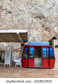 Red Cable Car Cabin Near Rock