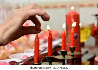 Red candle with fire. Selective focus