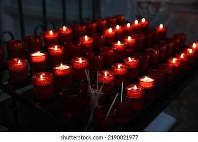 Red Candles Burning In The Church In Europe, Catholic Church Candles