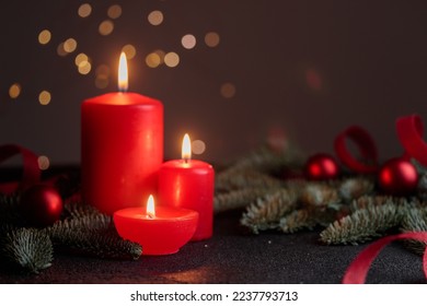 Red candles on dark background with bokeh lights Horizontal with copyspace - Powered by Shutterstock