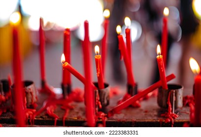 Red candles are placed on candlesticks to pay homage to the gods in the Chinese Naja Shrine, Chonburi Province, Thailand.
