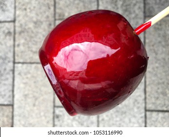 A Red Candy Apple On A Stick; Picture Taken In Leipzig, Germany.
