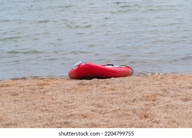 A Red Canoe On The Lake