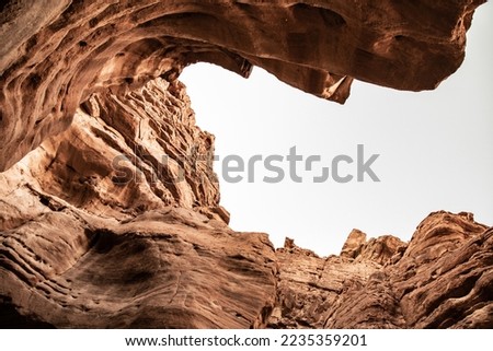 RED CANYON in israel with the sky, bottom view, sandy, brown, beige colors, texture, smooth lines, canyon, nature and desert