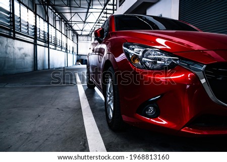 Red car body Object for service factory auto Car tail light red color 
 factory background for customers. Using wallpaper or background for transport or automotive automobile new car technology future