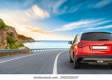 Red car drive on coastal road landscape. Highway view on the coast on way to summer vacation. Europe trip on beautiful travel road. Holiday travel by car driving on mountain road on beach in summer. - Powered by Shutterstock