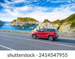 Red car drive on the road of mediterranean beach. driving on coast of France. Highway view on coast on way to summer holiday. Europe travel trip in sea coast road landscape. holiday journey on nature