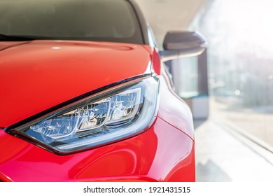 Red Car Headlight Close Up In The Car Interior.