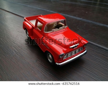 Red Car Kid Toys on wood backgrounds.