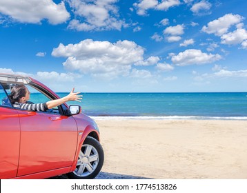 Red Car On The Beach. Vacation And Freedom Concept.