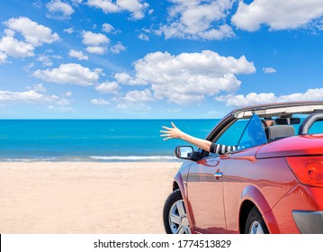 Red Car On The Beach. Vacation And Freedom Concept.