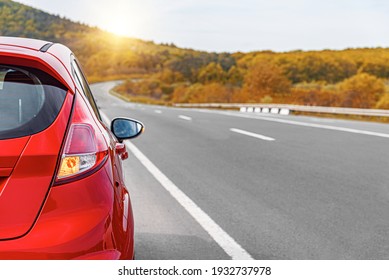 Red car on the side of the highway. Road trip. - Shutterstock ID 1932737978