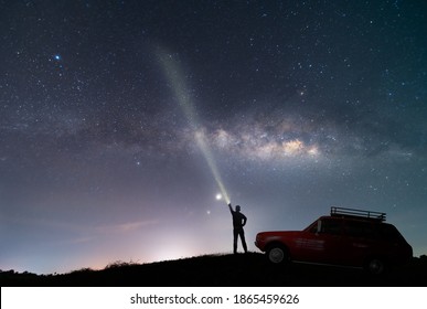 the red car over beautiful, wide blue night sky with stars and Milky way galaxy. Astronomy, orientation, clear sky concept and background.
