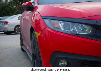 Red car parked in the parking place, Outdoor. - Shutterstock ID 1143468881