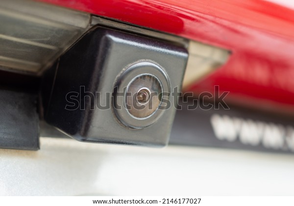 Red\
car rear view camera close up for parking\
assistance