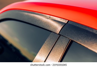 Red Car Showing The Weather Stripping Between The Front And Back Doors