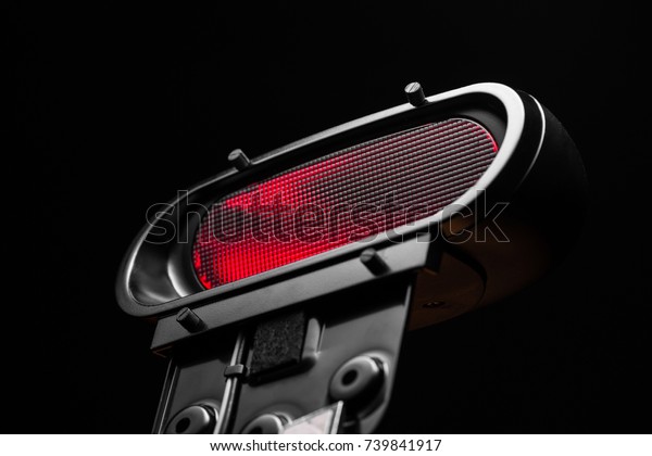 red car\
signal light on a black background\
isolated