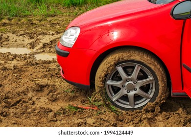 The Red Car Stuck In The Mud. Can Not Fall Out Of The Mud