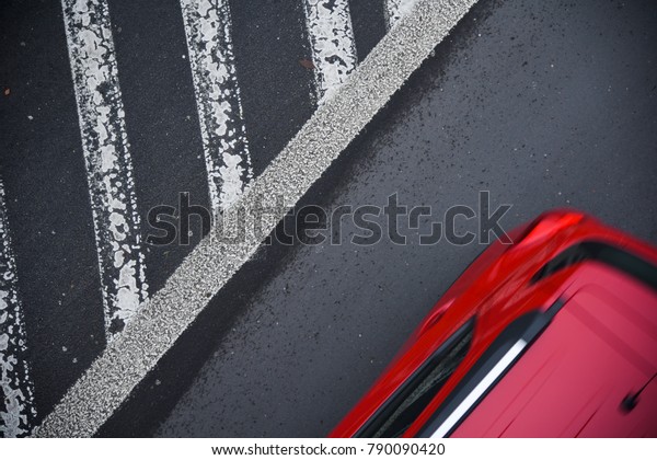 Red\
car and texture of asphalt. Road marking. Top\
view
