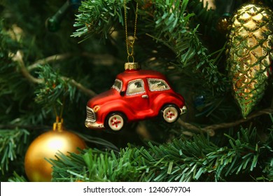 Red car toy, cone and ball, decorations on Christmas tree - Powered by Shutterstock