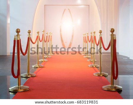 Red carpet between rope barriers in the success party