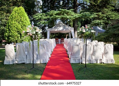 Red Carpet And Chairs For An Outdoor Wedding