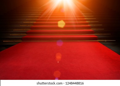 Red carpet on the stairs on a dark background. The path to glory, victory and success
