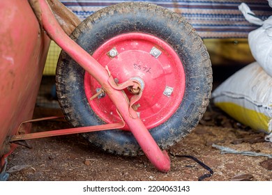 Red Cart Wheel In A Fish Farmer's Warehouse