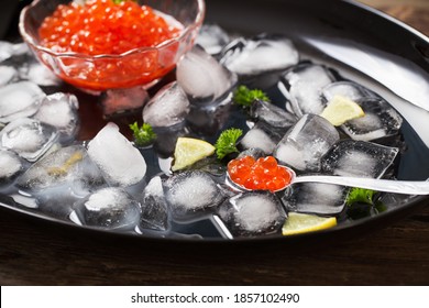 Red Carviar With Ice On Black Plate