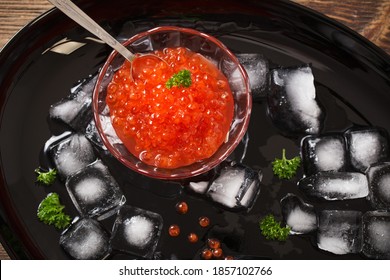 Red Carviar With Ice On Black Plate