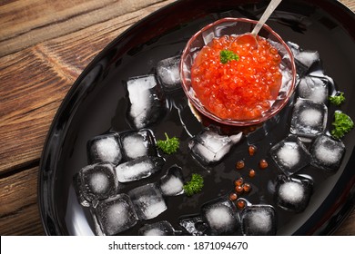 Red Carviar With Ice On Black Plate