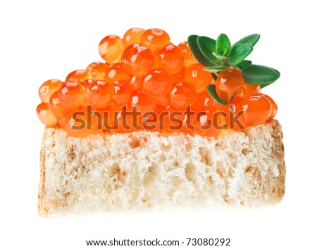 Red caviar sandwich with thyme twig, isolated on white macro