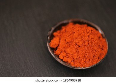 Red cayenne pepper powder.Hot pungent spice. Spices and seasonings.Ground red pepper	 - Shutterstock ID 1964908918