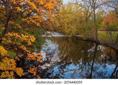 Red Cedar River Winding Through Michigan State University Campus During The Fall