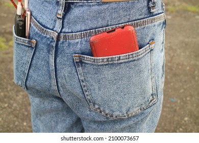 Red Cell Phone In Back Pocket Photo