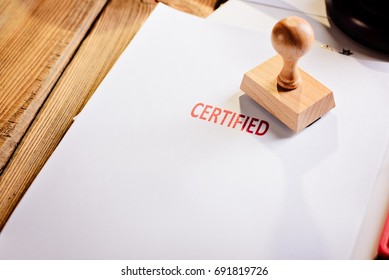 Red Certified Rubber Stamp On White Sheet Of Paper. Law Office.