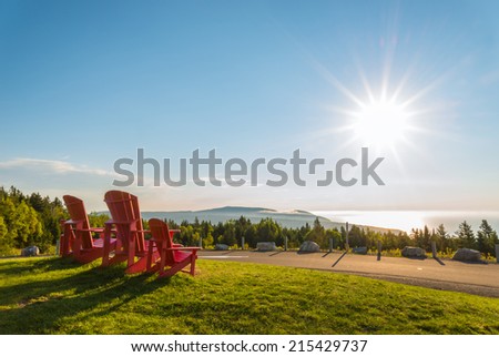 Red chairs from Butland lookoff  with a beautiful view of Fundy Shore scenery (Fundy National Park, New Brunswick, Canada)