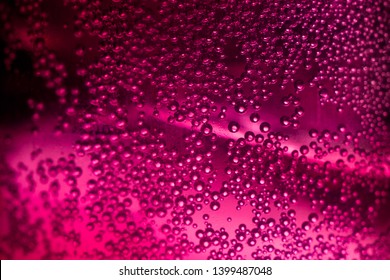 Red Champagne,Effervescent drink. Underwater fizzing air bubbles texture background