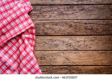 Red Checkered Napkin On A Wooden Table.