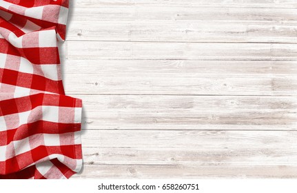 Red Checkered Picnic Tablecloth On White Wood Table