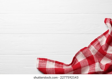 Red checkered tablecloth on wooden table, top view. Space for text - Powered by Shutterstock